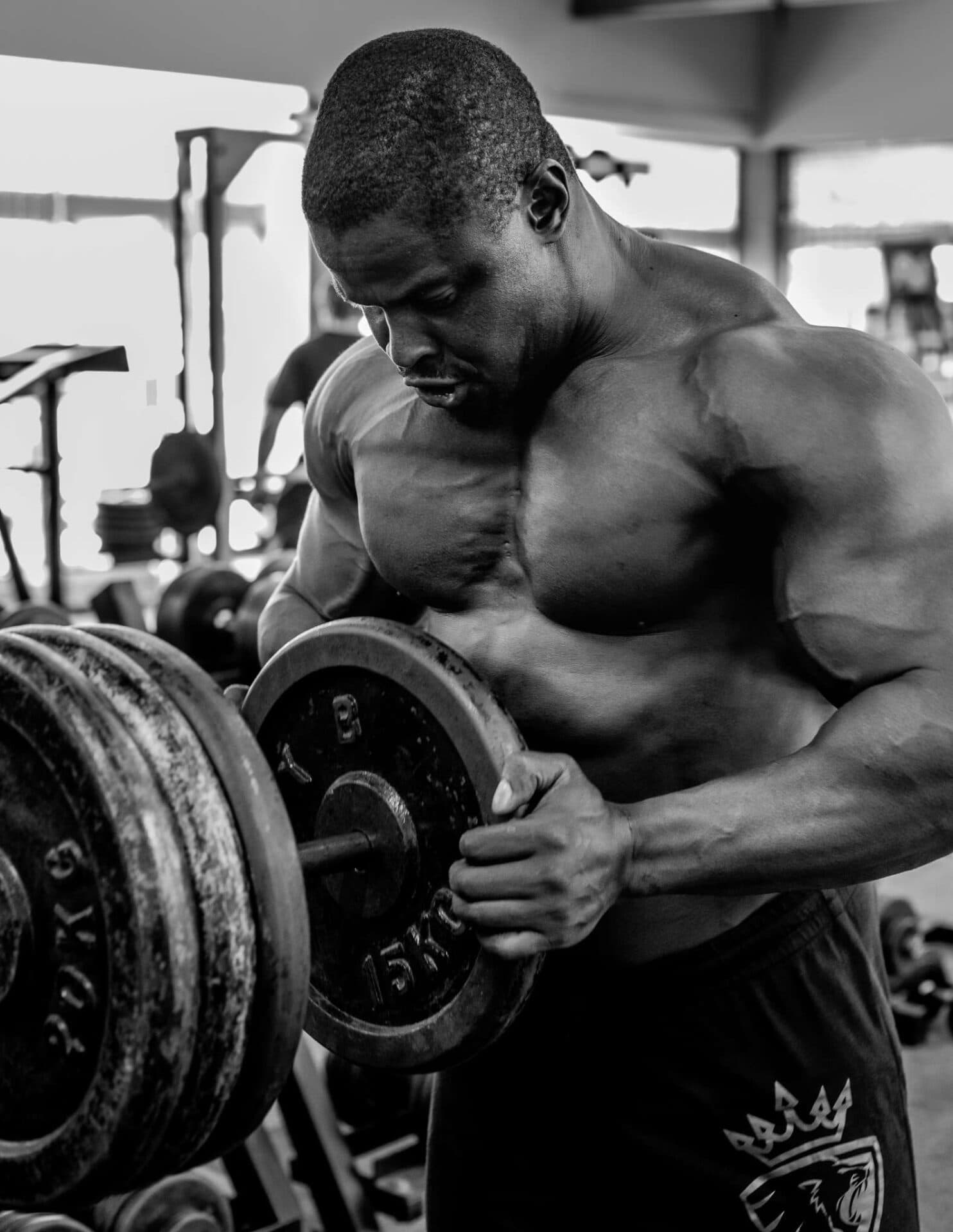 Black Bull manifesto athlete loading weight plates